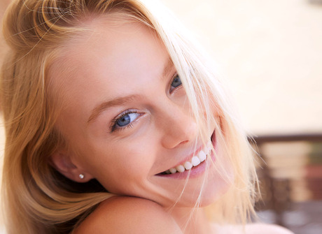 Blonde babe Nancy A spreads to display shaved pussy before highlighting nice ass - 9 of 16