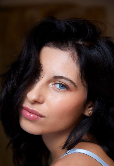 Blue-eyed beauty Lilly Bella teases with feet and perky tits in bedroom - 4 of 16