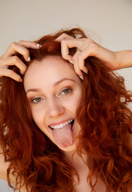 Fall in love with redhead Cherry Candle in high heels that strips to show shaved pussy - 12 of 16