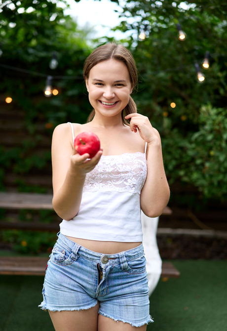 Cute teen poser Yenn Cat stripping off jean shorts and teasing outdoors