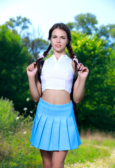 Slender cutie Feolla undressing and posing nude in nature - 2 of 16