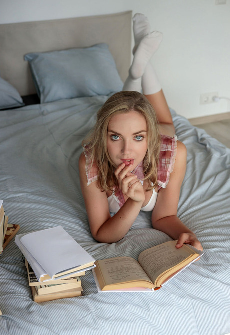 College babe with tan lines Oxana Chic studies for exams and teases with pussy - 2 of 16