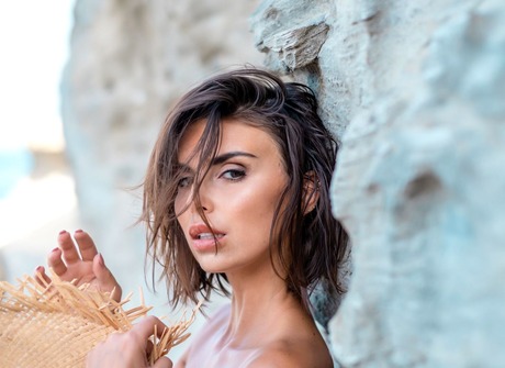 Fit erotic model Laura Giraudi posing nude outdoors by the ocean