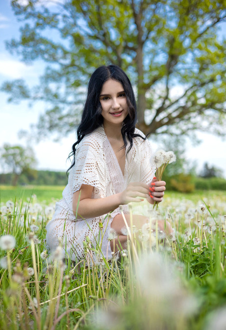 Naughty teen babe Sasha Jane strips and poses naked outdoors in dandelions - 1 of 16