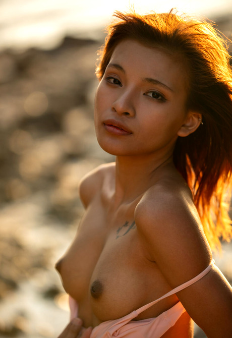 Asian babe with short hair Oopeve strips bikini to reveal perky tits on beach - 5 of 16