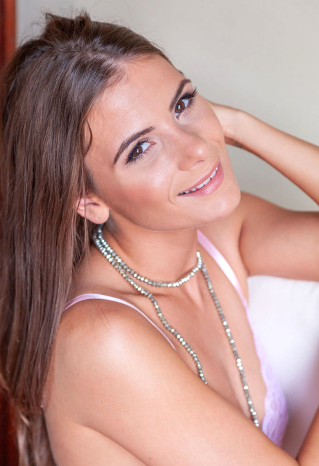 Stunning brunette babe Csilla shows shaved pussy and feet during seductive teasing