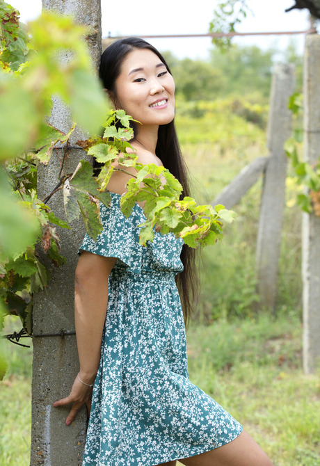 Asian beauty Katana taking off dress and sharing small tits outdoors