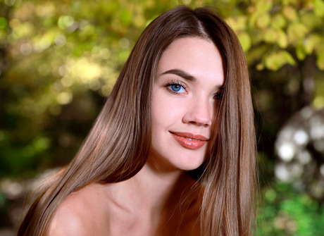 Stunning Georgia from Russia wears long boots outdoors while teasing