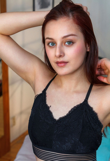 Cute perky redhead Olivia Honey undressing for the camera in erotic nudes - 7 of 16