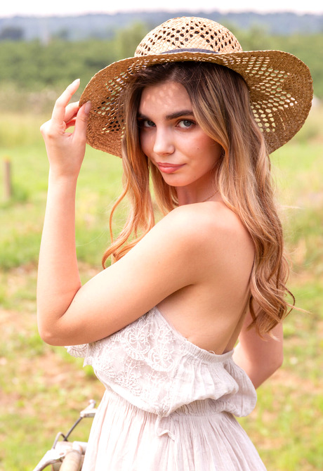 Beautiful nude model Annette sensually stripping and posing outdoors