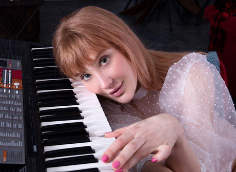 Redhead pianist Emily Blake unveils big tits and shaved pussy while spreading - 3 of 12