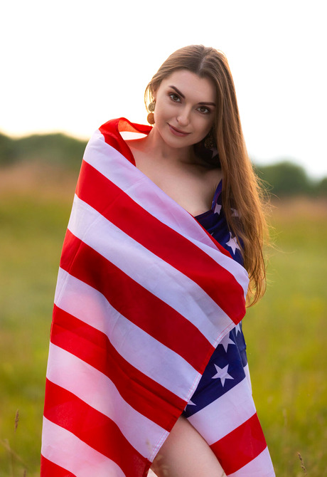 Brunette babe Monika May celebrates 4th of July with USA Flag with perky tits out - 1 of 12