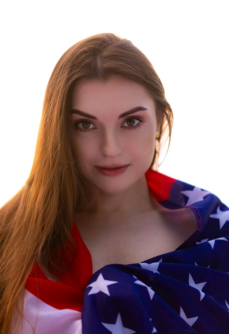 Brunette babe Monika May celebrates 4th of July with USA Flag with perky tits out
