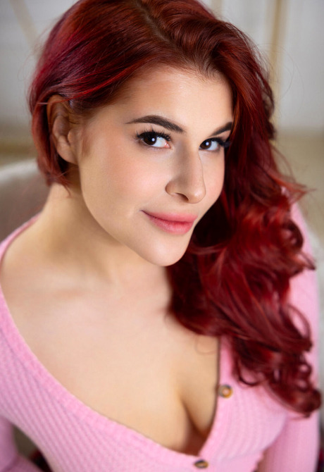 Redhead Pandora Red reveals big tits while flaunting sexy figure in stockings - 2 of 16