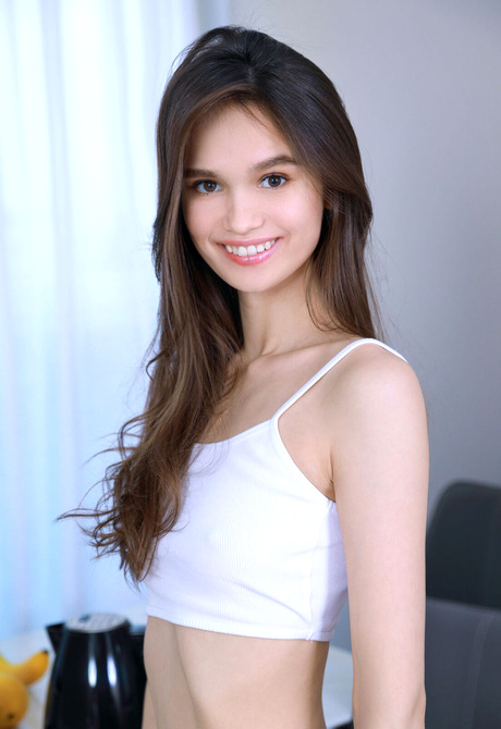 Cute Anastasia Bella teasing with skinny figure by stripping everything but white socks