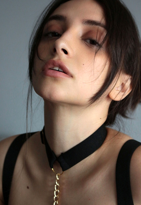 Brunette babe Olivia Linz wears stockings and high heels during a teasing session - 6 of 12